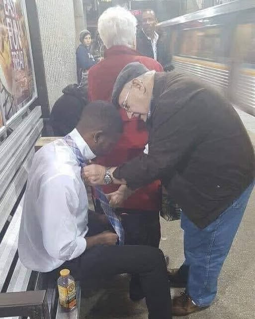 A Tie, a Touch, and a Moment of Community…g